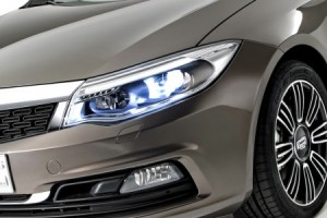 Qoros-3-Sedan-detail-front-qtr-lights-on-450x300