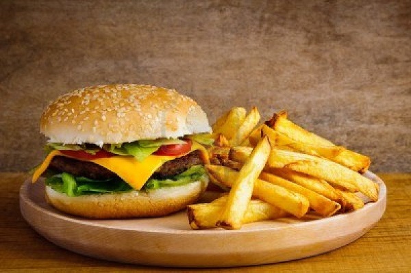 13968864-fast-food-hamburger-and-french-fries-on-a-wooden-plate