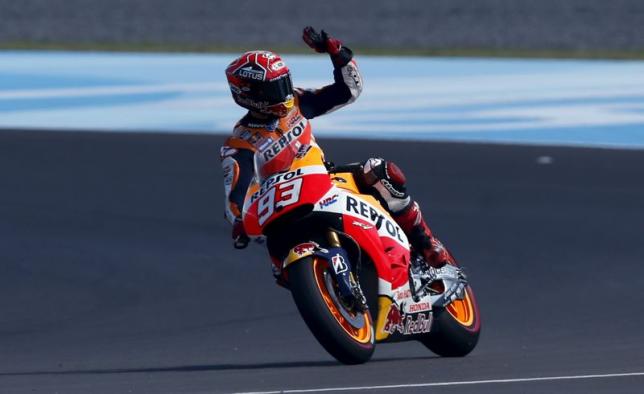 Honda MotoGP rider Marquez of Spain waves to fans as he celebrates his pole position after the qualifying session at Argentina's MotoGP Grand Prix at the Termas de Rio Hondo International circuit in Termas de Rio Hondo